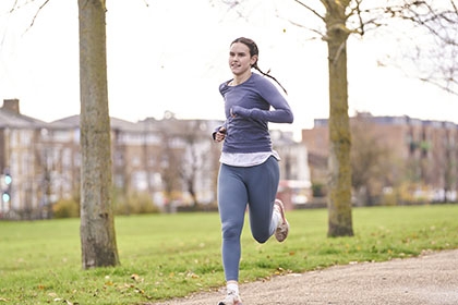 A woman runs in the park