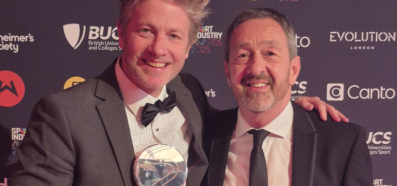 Sport England executive director for digital, marketing and communications poses with CBE and Chair for Sport England, Chris Boardman while holding the Environmental Sustainability award at the Sport Industry Awards