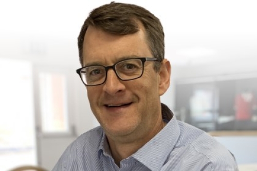 Headshot of Simon Hayes.